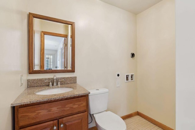 24 Cassella Dr, Jefferson, ME 04348 - half bathroom featuring toilet, vanity, and baseboards