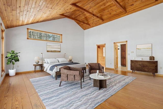 24 Cassella Dr, Jefferson, ME 04348 - bedroom featuring wooden ceiling with exposed beams, light wood-style floors, high vaulted ceiling, and baseboards