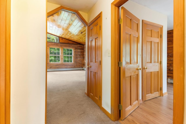 37 Boulder Dr, Auburn, ME 04210 - hall with vaulted ceiling, baseboard heating, a baseboard heating unit, light carpet, and log walls