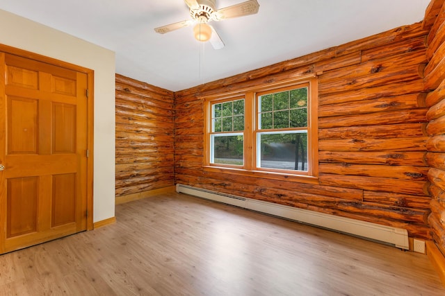 37 Boulder Dr, Auburn, ME 04210 - spare room with a baseboard radiator, rustic walls, light wood-type flooring, a ceiling fan, and baseboards