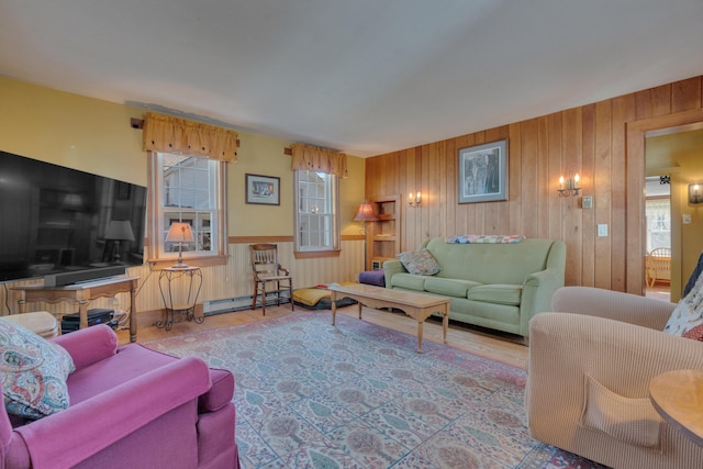 25 Church St, Gorham, ME 04038 - living area featuring healthy amount of natural light, wood walls, a baseboard heating unit, and wood finished floors
