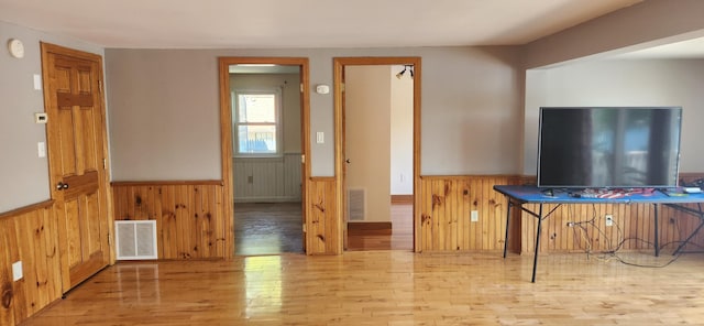 162 30th St, Shapleigh, ME 04076 - dining room with a wainscoted wall, wood finished floors, and wood walls