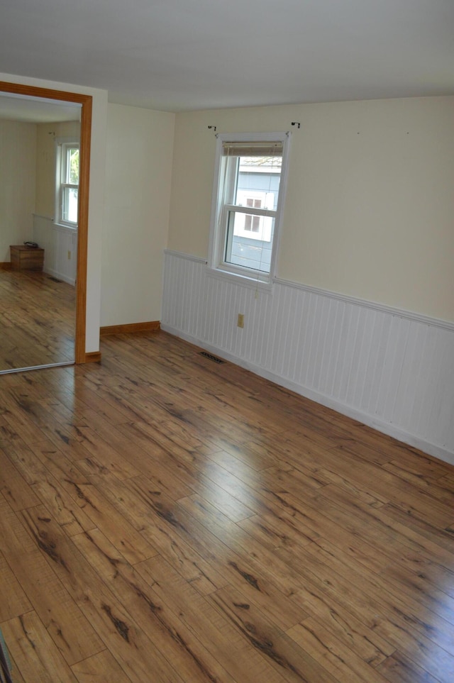 162 30th St, Shapleigh, ME 04076 - unfurnished room with hardwood / wood-style flooring and a wainscoted wall