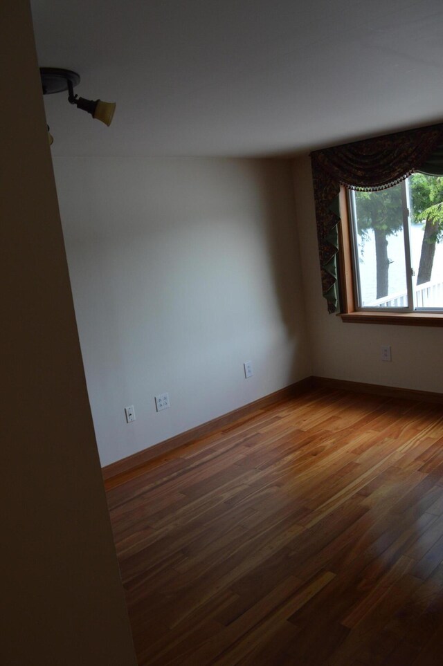 162 30th St, Shapleigh, ME 04076 - empty room with wood finished floors and baseboards