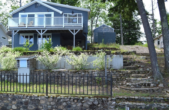 162 30th St, Shapleigh, ME 04076 - rear view of house with a storage unit and a wooden deck