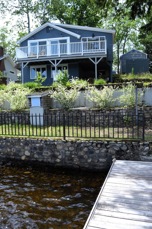 162 30th St, Shapleigh, ME 04076 - dock area featuring a fenced backyard, a water view, and a balcony