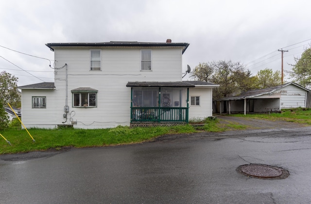 144 6th Ave, Madawaska, ME 04756 - rear view of property with a chimney and a sunroom