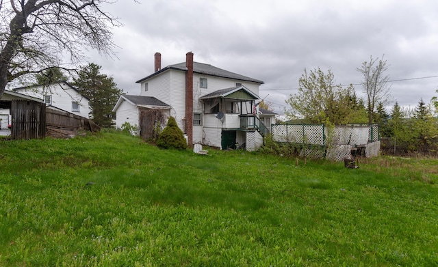 144 6th Ave, Madawaska, ME 04756 - rear view of house featuring a chimney