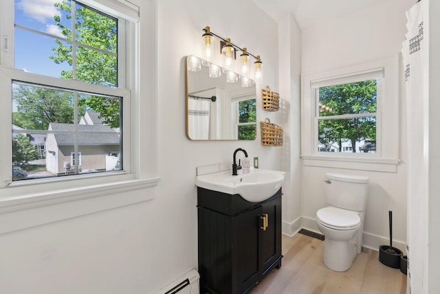 239 Auburn St, Portland, ME 04103 - full bathroom with vanity, wood finished floors, toilet, baseboards, and a shower with curtain