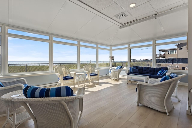 31 E Grand Ave Unit 80, Old Orchard Beach, ME 04064 - sunroom / solarium featuring wood finished floors and a water view
