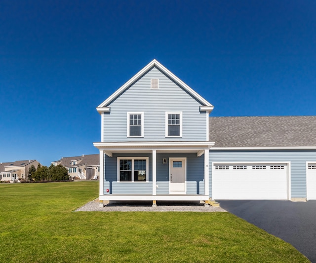 186 Falcon Crest Dr Unit 57, Gorham, ME 04038 - traditional home with covered porch, a front yard, asphalt driveway, and an attached garage