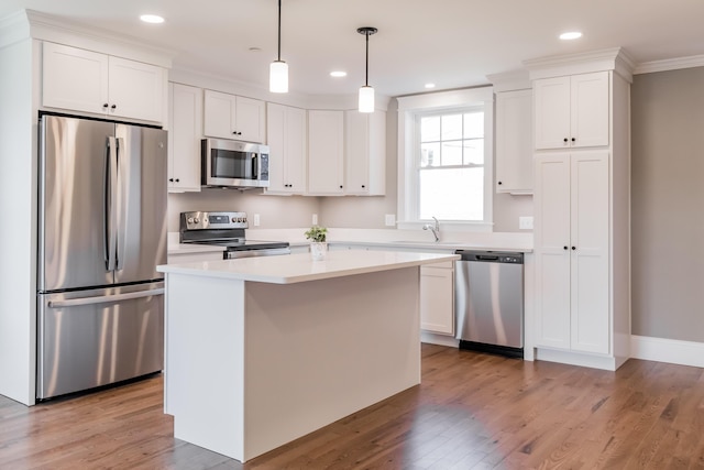 186 Falcon Crest Dr Unit 57, Gorham, ME 04038 - kitchen featuring appliances with stainless steel finishes, a sink, white cabinetry, light wood finished floors, and recessed lighting