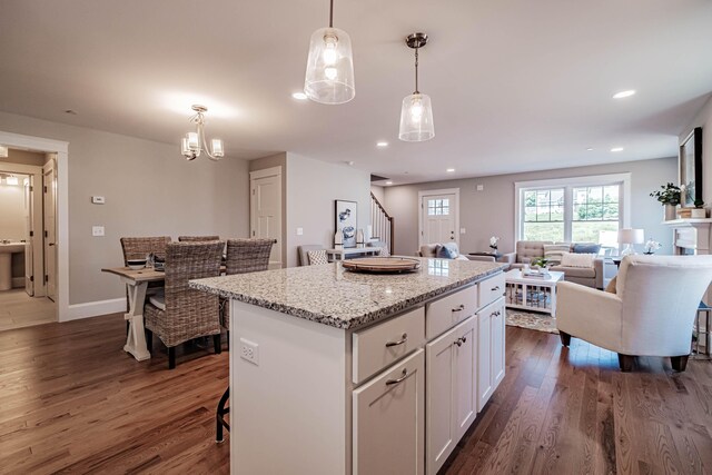 186 Falcon Crest Dr Unit 57, Gorham, ME 04038 - kitchen with dark wood finished floors, white cabinetry, a kitchen island, open floor plan, and recessed lighting