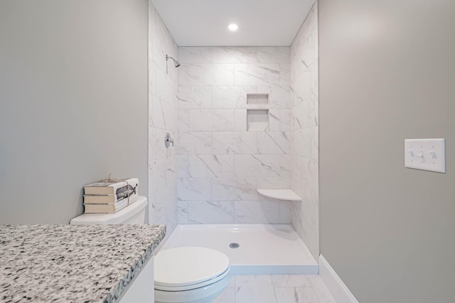 186 Falcon Crest Dr Unit 57, Gorham, ME 04038 - full bath featuring marble look tiles, toilet, a tile shower, vanity, and baseboards