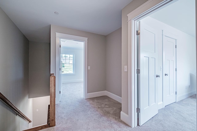 186 Falcon Crest Dr Unit 57, Gorham, ME 04038 - hallway with light carpet, baseboards, and an upstairs landing