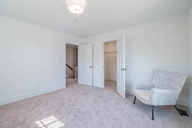 186 Falcon Crest Dr Unit 57, Gorham, ME 04038 - sitting room with carpet flooring, an upstairs landing, and baseboards