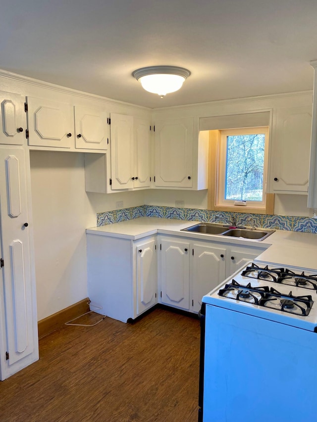 48 River Rd, Buxton, ME 04093 - kitchen featuring gas range oven, a sink, dark wood finished floors, white cabinets, and baseboards