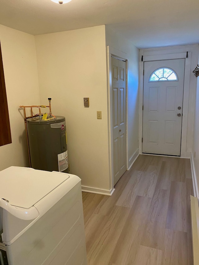 48 River Rd, Buxton, ME 04093 - laundry area featuring water heater, washer / clothes dryer, light wood-type flooring, and baseboards