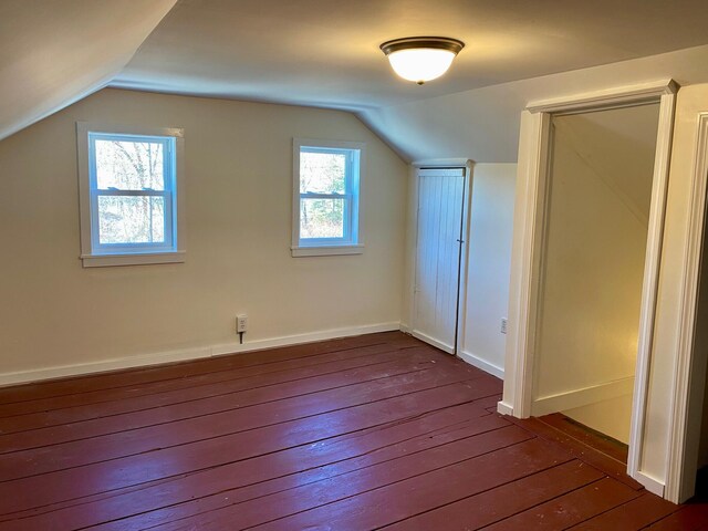 48 River Rd, Buxton, ME 04093 - bonus room featuring dark wood-style floors, vaulted ceiling, and baseboards