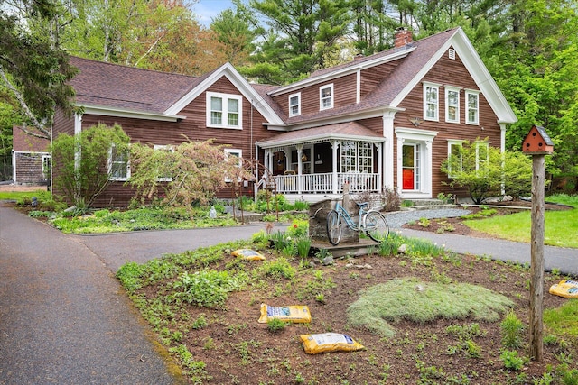 62 Blackswoods Rd, Franklin, ME 04634 - shingle-style home with a porch, a chimney, and a shingled roof