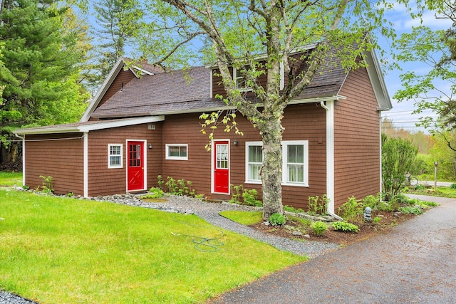 62 Blackswoods Rd, Franklin, ME 04634 - view of front facade featuring a shingled roof and a front yard