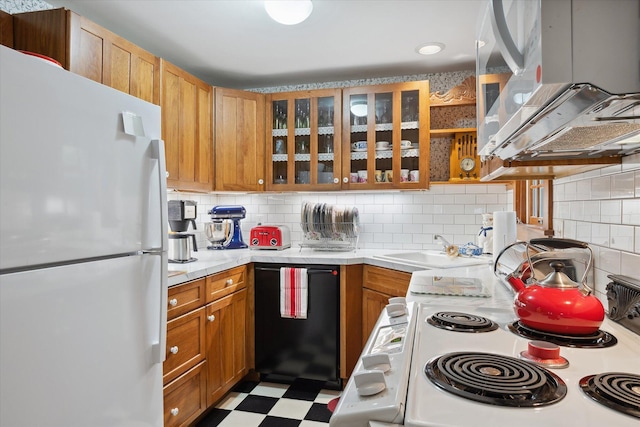 62 Blackswoods Rd, Franklin, ME 04634 - kitchen with white appliances, light countertops, backsplash, a sink, and light floors