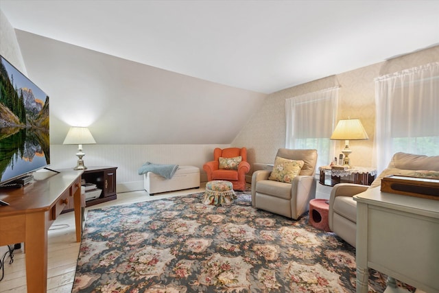 62 Blackswoods Rd, Franklin, ME 04634 - living room featuring wallpapered walls, wood finished floors, and vaulted ceiling