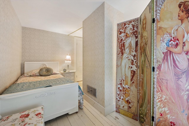 62 Blackswoods Rd, Franklin, ME 04634 - bedroom featuring wallpapered walls and light wood-style floors