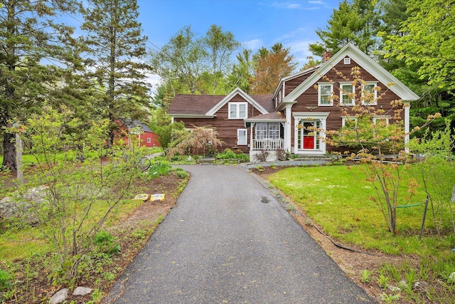62 Blackswoods Rd, Franklin, ME 04634 - view of front of home featuring a chimney, a front yard, and asphalt driveway