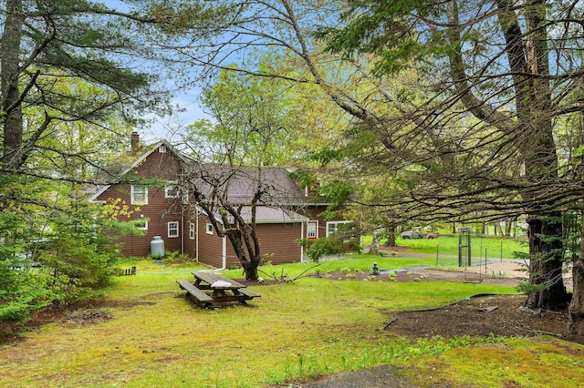 62 Blackswoods Rd, Franklin, ME 04634 - view of side of property with a yard and a chimney