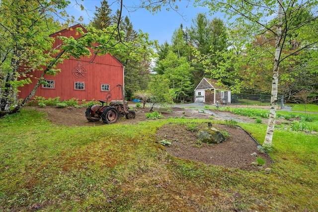 62 Blackswoods Rd, Franklin, ME 04634 - view of grassy yard featuring an outbuilding and a barn