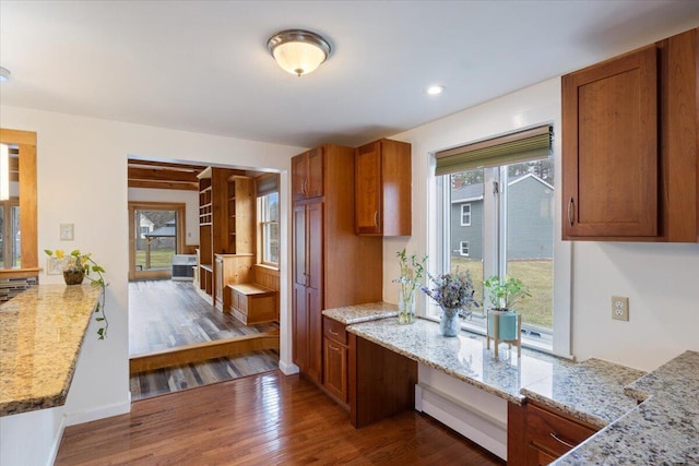 4 Buttonwood Rd, South Berwick, ME 03908 - kitchen with wood finished floors, brown cabinets, light stone countertops, recessed lighting, and baseboards