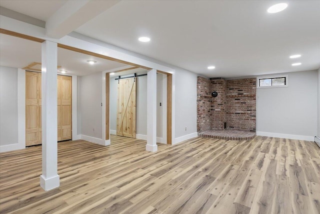 4 Buttonwood Rd, South Berwick, ME 03908 - basement with wood finished floors, a barn door, baseboards, and recessed lighting
