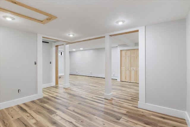 4 Buttonwood Rd, South Berwick, ME 03908 - finished below grade area with wood finished floors, recessed lighting, baseboards, and a baseboard heating unit