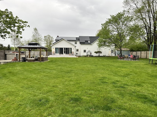 4 Buttonwood Rd, South Berwick, ME 03908 - rear view of property with a gazebo, roof mounted solar panels, and a patio area