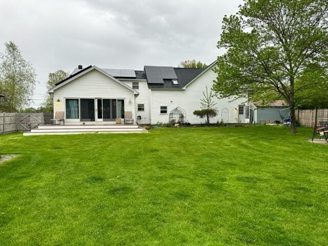4 Buttonwood Rd, South Berwick, ME 03908 - back of property with solar panels and a patio