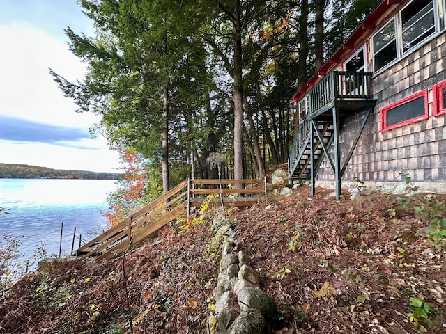 63 Naples Rd, Harrison, ME 04040 - view of yard with stairs and a deck with water view