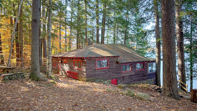 63 Naples Rd, Harrison, ME 04040 - view of side of home with a chimney and roof with shingles