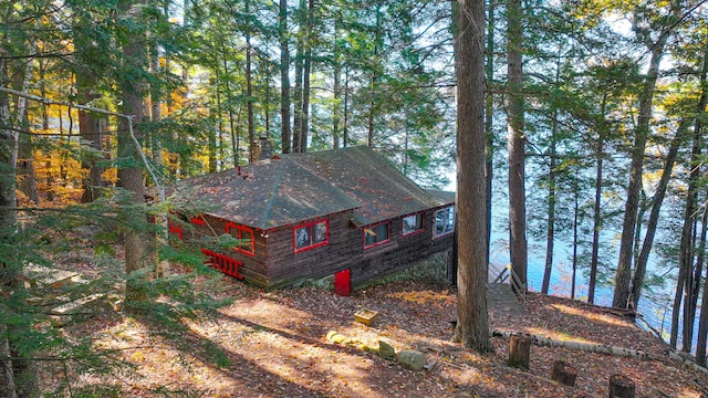 63 Naples Rd, Harrison, ME 04040 - view of side of home featuring a water view and a shingled roof