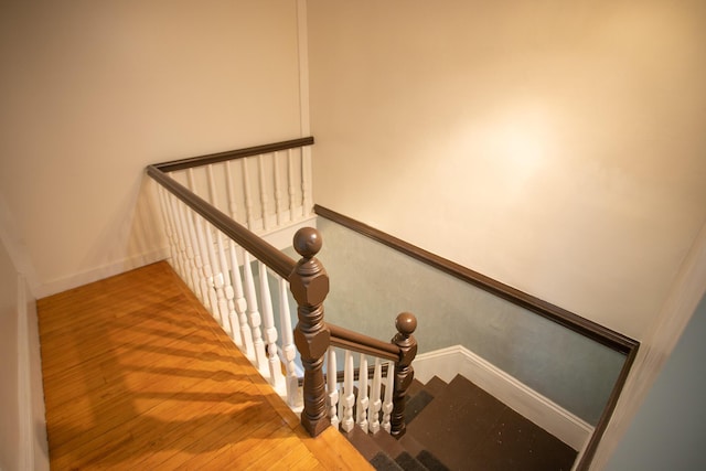 28 Pier St, Bangor, ME 04401 - stairway with baseboards and wood finished floors