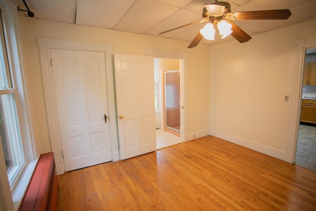 28 Pier St, Bangor, ME 04401 - unfurnished bedroom featuring light wood-style flooring, baseboards, and a ceiling fan
