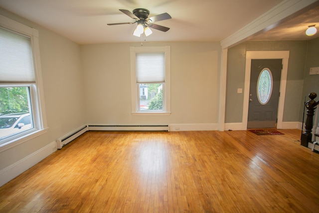 28 Pier St, Bangor, ME 04401 - foyer entrance with healthy amount of natural light, light wood finished floors, and a ceiling fan