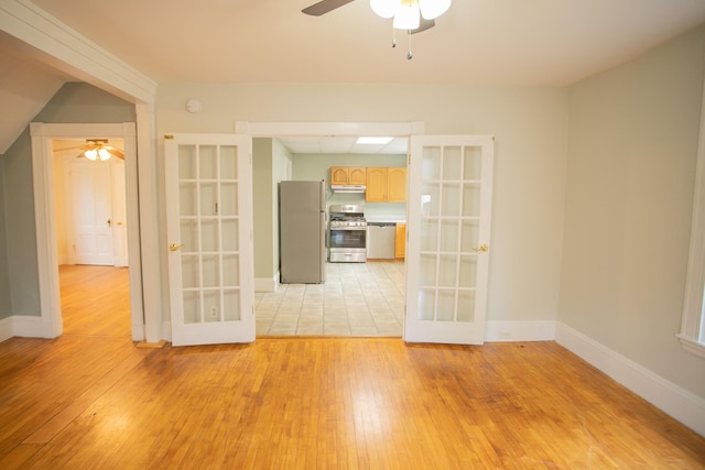 28 Pier St, Bangor, ME 04401 - spare room with french doors, ceiling fan, light wood finished floors, and baseboards