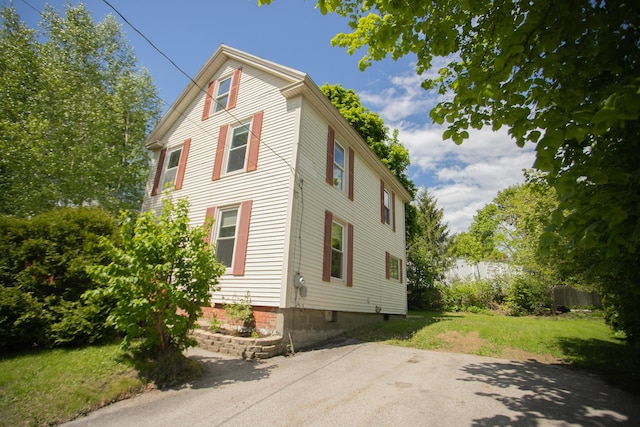 28 Pier St, Bangor, ME 04401 - view of side of home with a lawn