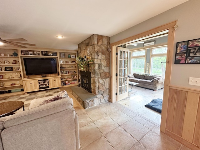 7 Ponderosa Ln, Biddeford, ME 04005 - tiled living room with ceiling fan, built in features, and a fireplace