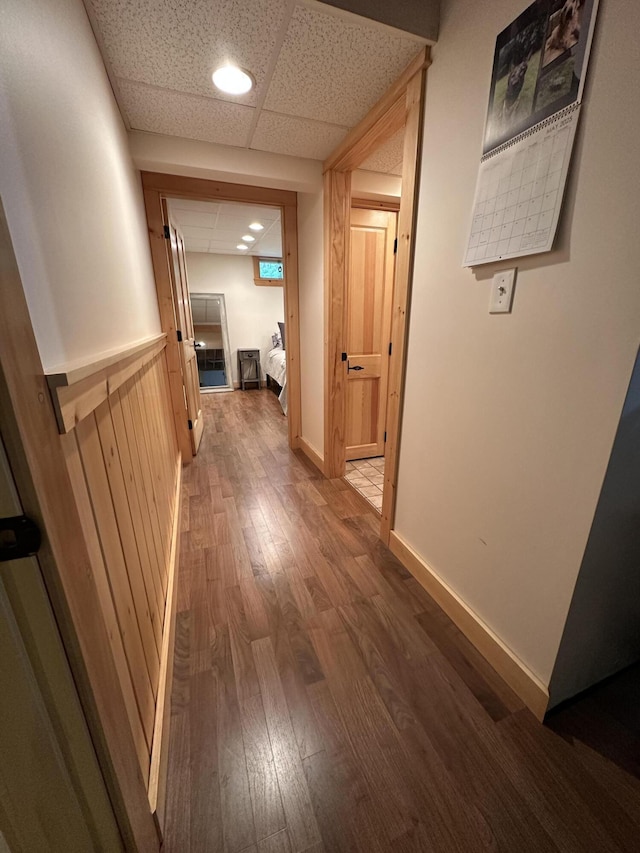 7 Ponderosa Ln, Biddeford, ME 04005 - hallway with wood finished floors, a drop ceiling, and baseboards