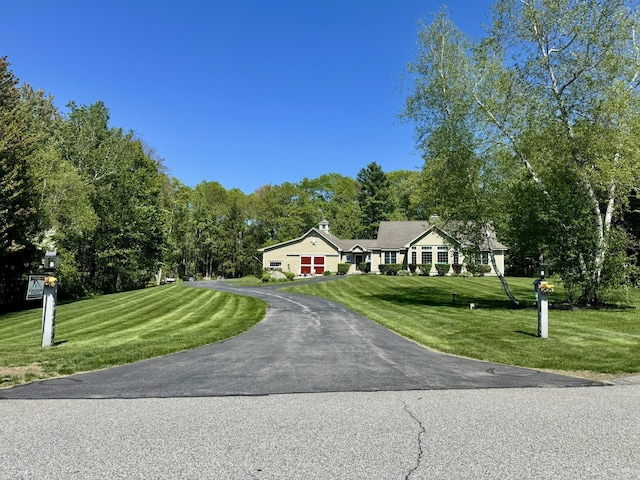 7 Ponderosa Ln, Biddeford, ME 04005 - single story home with driveway, an attached garage, and a front lawn