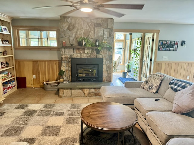 7 Ponderosa Ln, Biddeford, ME 04005 - tiled living area featuring a wainscoted wall, ceiling fan, wood walls, and healthy amount of natural light