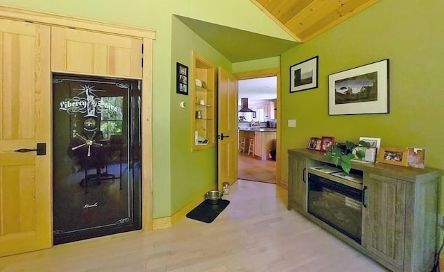 7 Ponderosa Ln, Biddeford, ME 04005 - hall with lofted ceiling, wood finished floors, wood ceiling, and baseboards