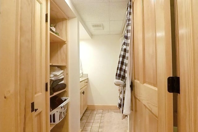 7 Ponderosa Ln, Biddeford, ME 04005 - walk in closet with a drop ceiling and light tile patterned flooring